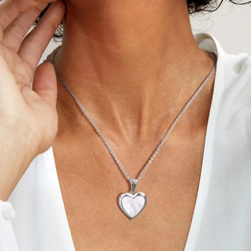 COLGANTE RELICARIO CORAZÓN NÁCAR ACERO Y ORO